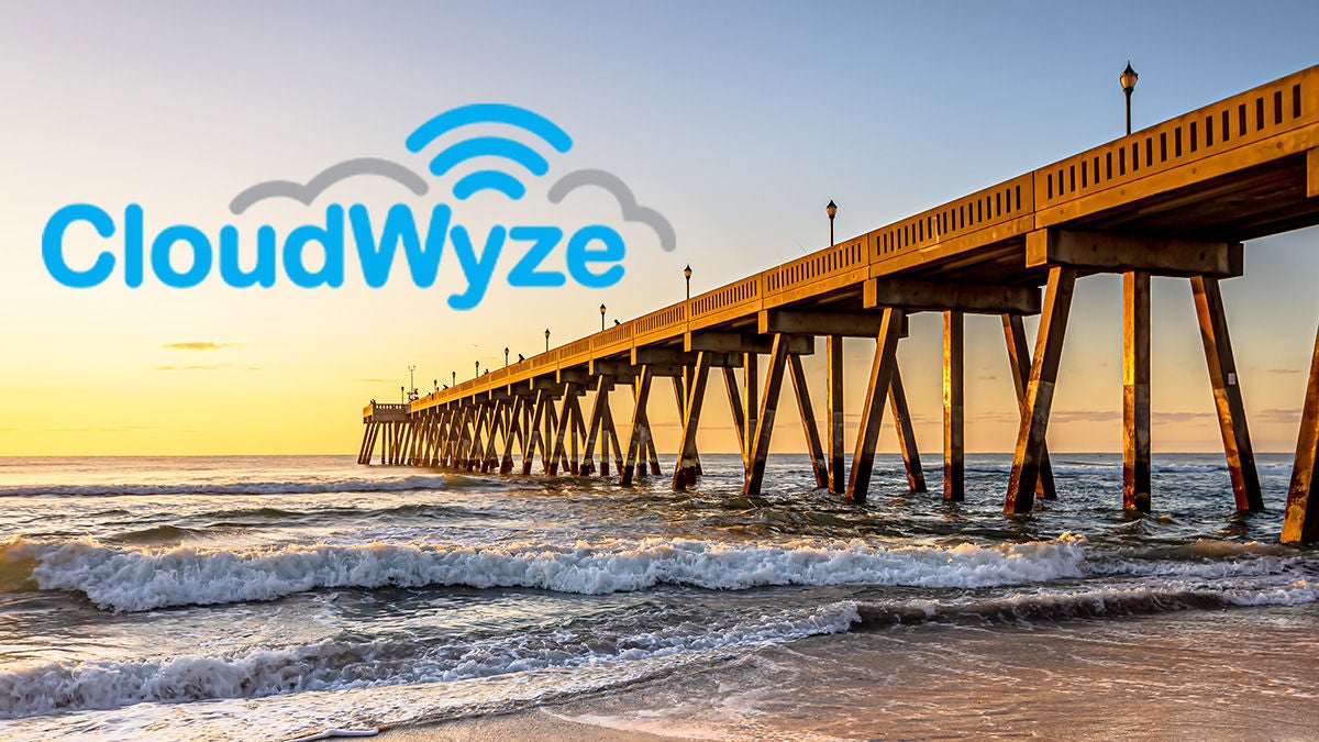 CloudWyze logo over coastal scene