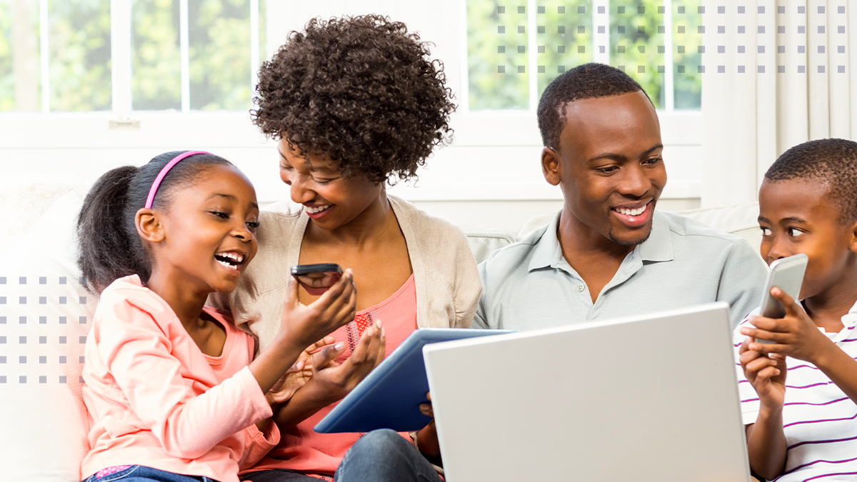 family on devices smiling