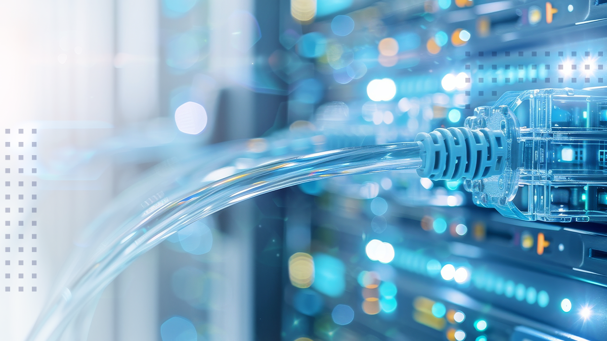 A macro close up of an ethernet cord plugged into a server with bright lights