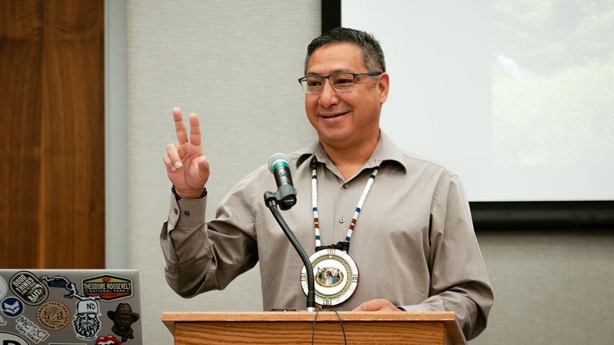 A man discussing tribal broadband at a conference