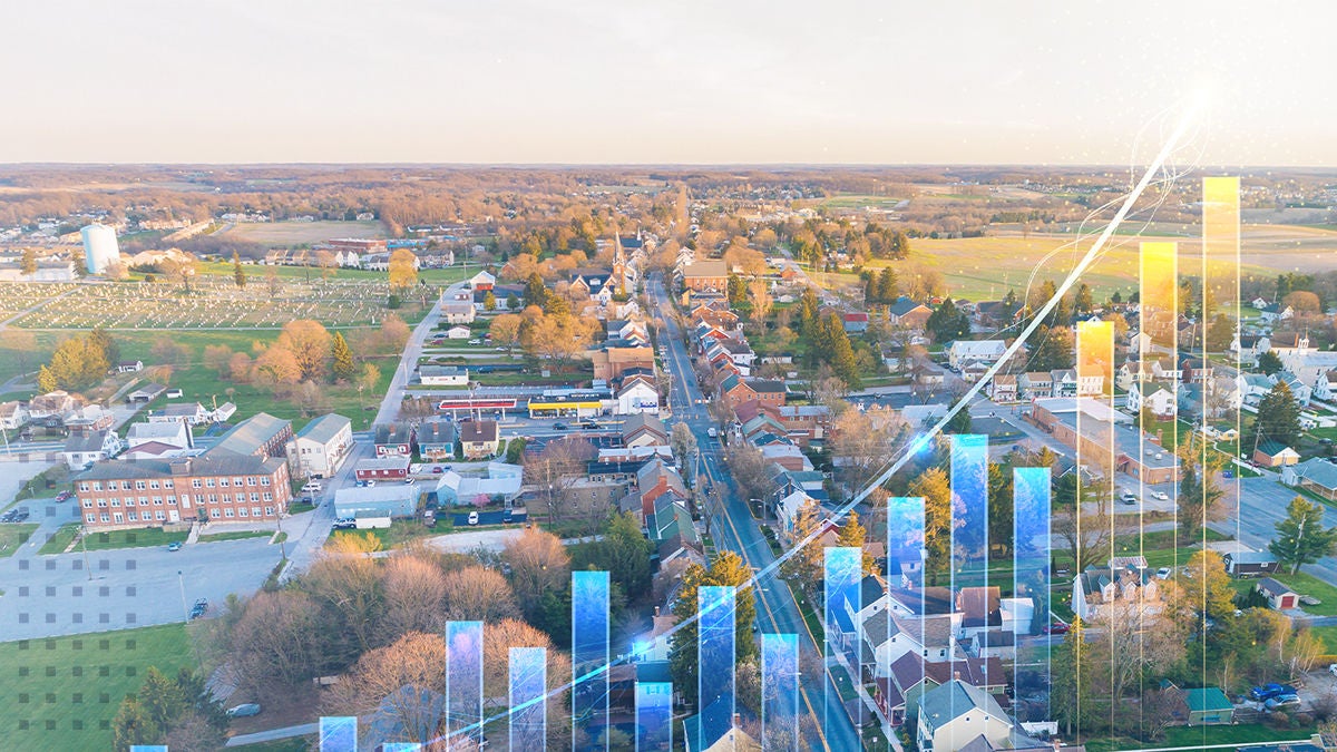 birds eye view of rural town with growing bar graph