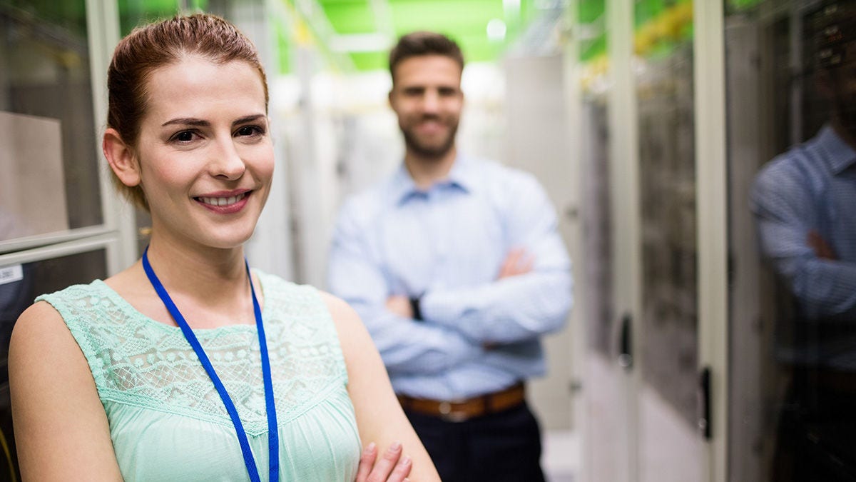 Smiling engineers standing