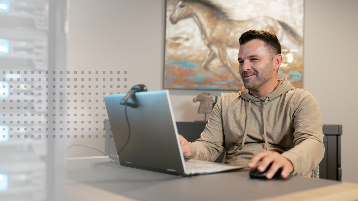 A man using tribal broadband on his laptop for a video call