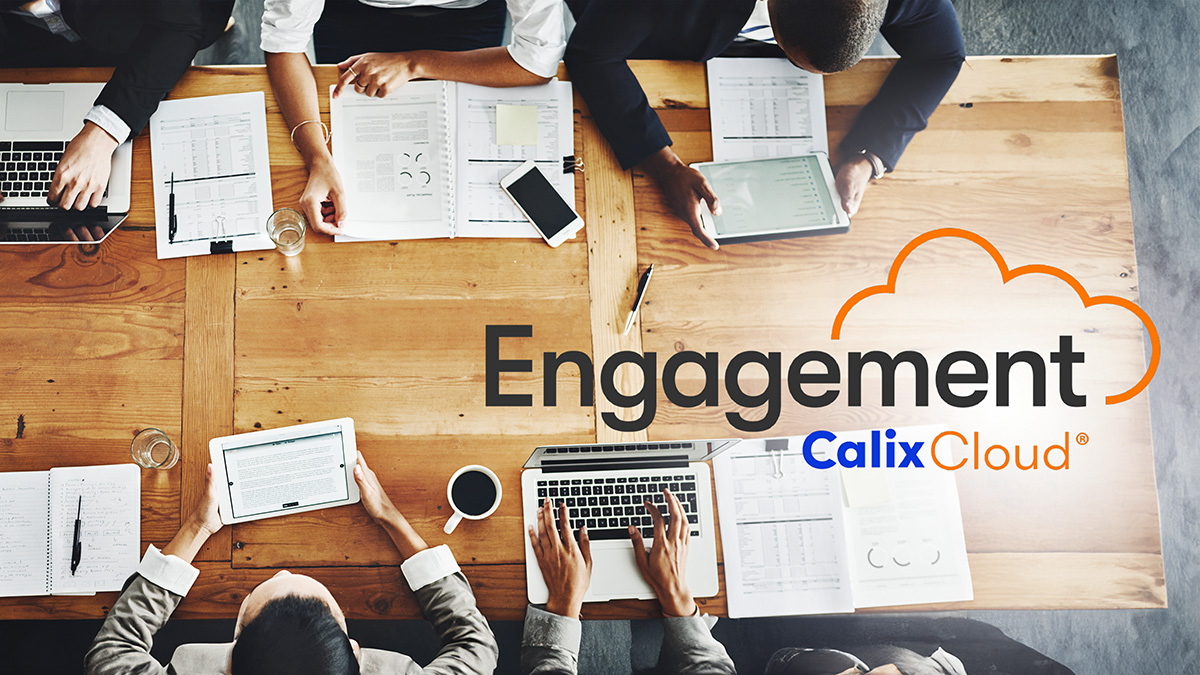 Engagement Cloud logo over conference table with people on devices