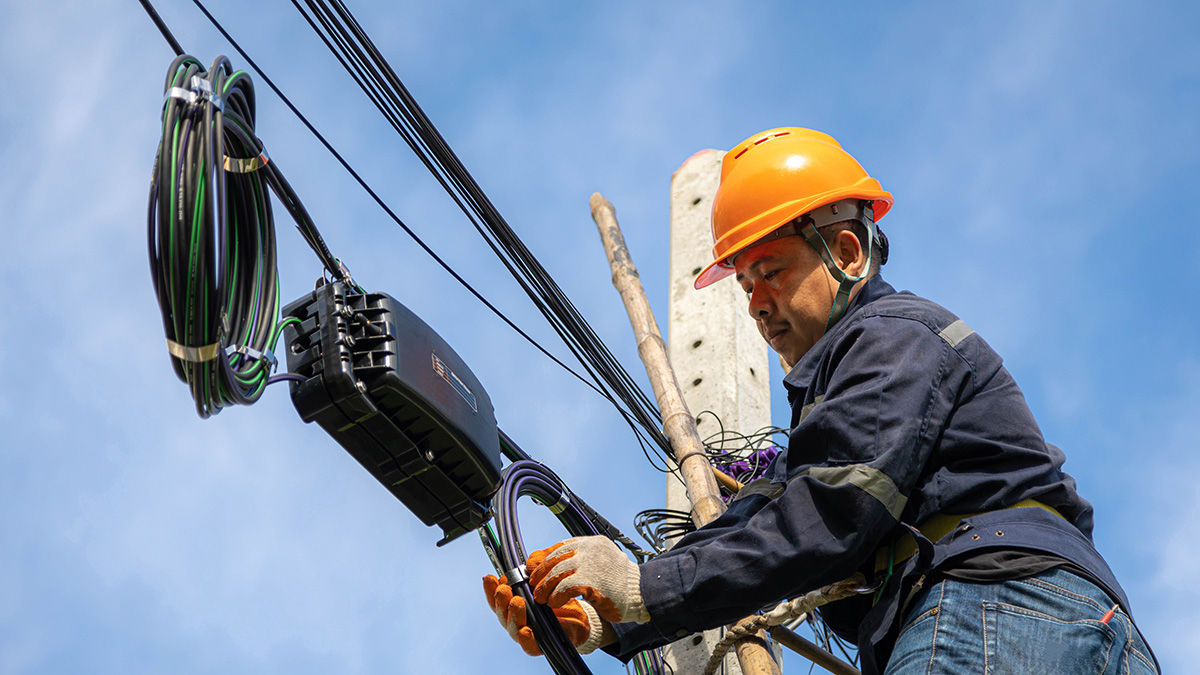 cable technician on pole